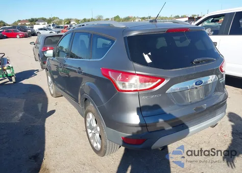 2014 Ford Escape Titanium z USA, uszkodzony, nr VIN 1FMCU0J99EUB62087